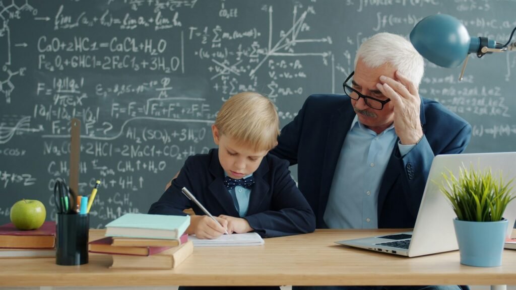 An experienced tutor guiding a young student through written work at a desk